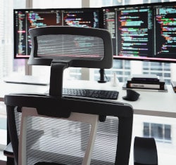 Office Chair in front of Screens